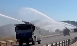 Kontrol altına alınan orman yangınında peş peşe sıralanan TOMA'ların müdahalesi
